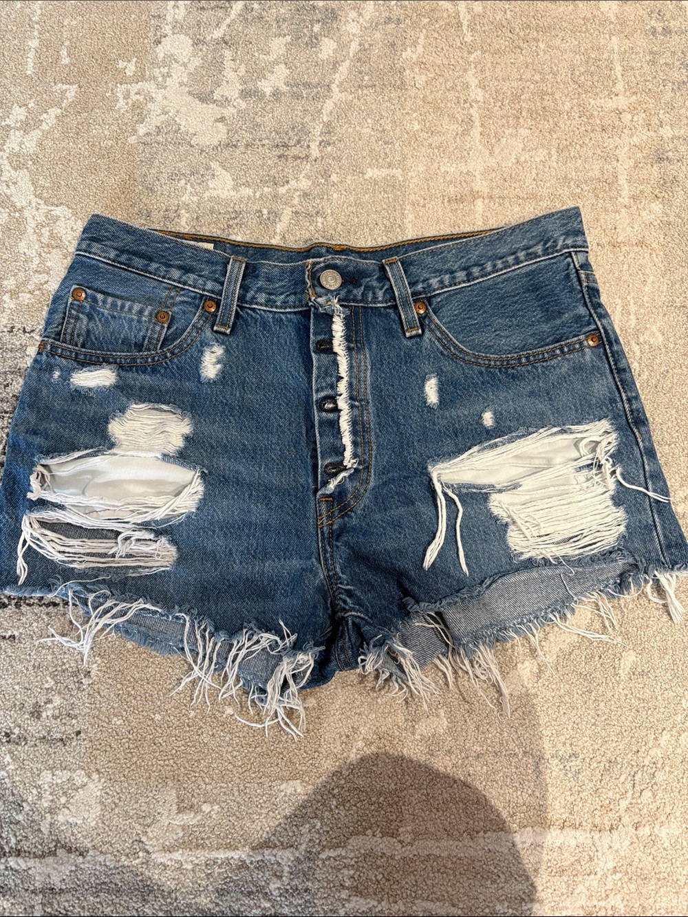 Levi’s High-Rise Distressed Denim Shorts in Dark Blue